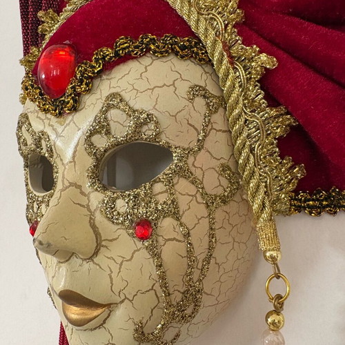 Decorative mask with red velvet details and gold embellishments, like new