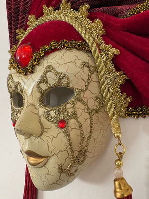 Decorative mask with red velvet details and gold embellishments, like new