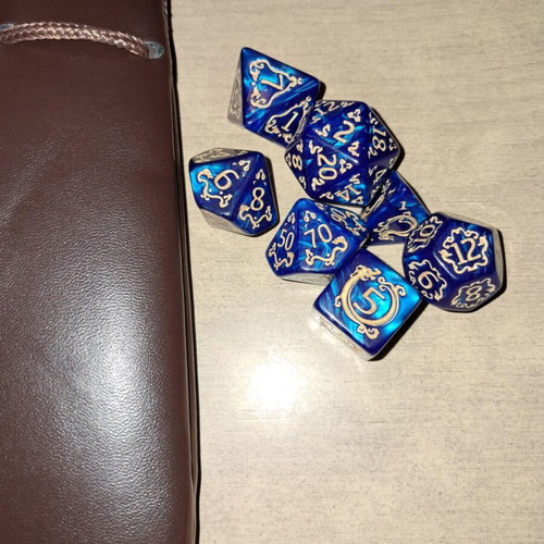 Big brown leather dice bag with blue dragon dice