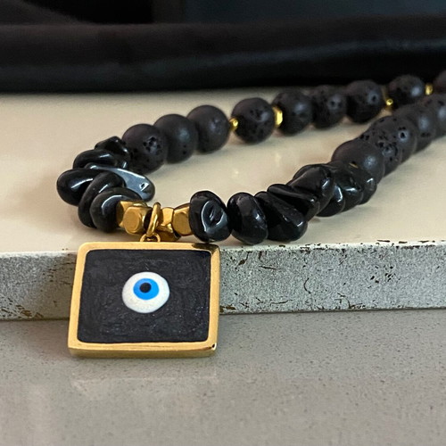 Handmade necklace with black lava stones and protective eye new
