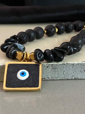 Handmade necklace with black lava stones and protective eye new