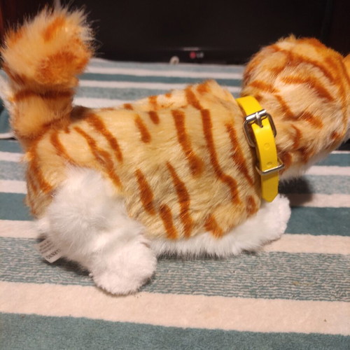 Interactive plush cat with yellow collar, like new