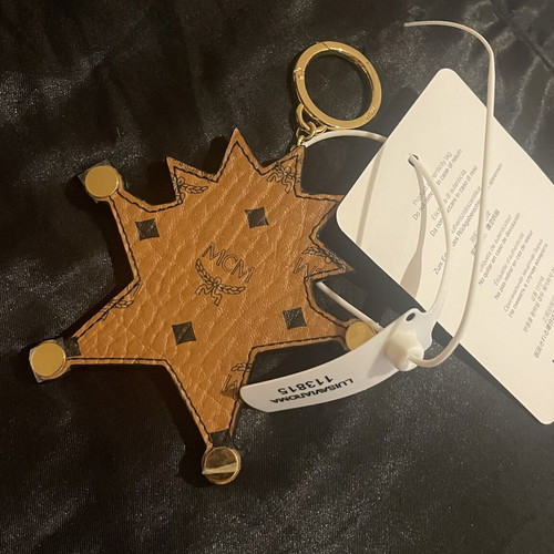MCM Star Lion bag charm new, black and brown