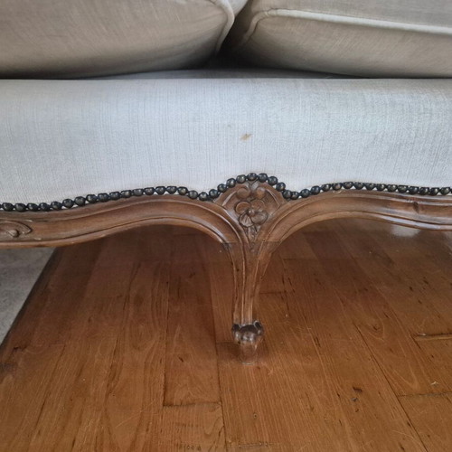 Handmade carved walnut loveseat with cream velvet fabric