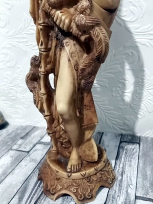Decorative tabletop statue of Asian man like new