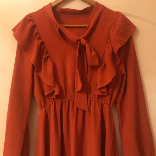 Coral dress like new with ruffles and front frill