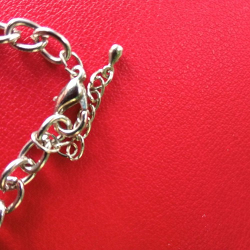 Bracelet with hanging charms used