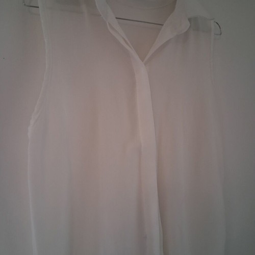 Sleeveless white shirt top