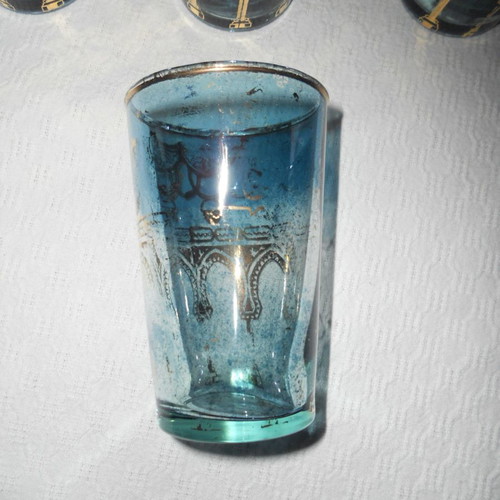 Set of 7 vintage blue-turquoise drinking glasses with gold Arabic decoration