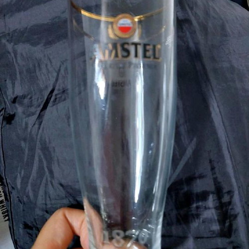 Amstel beer glass with a golden rim