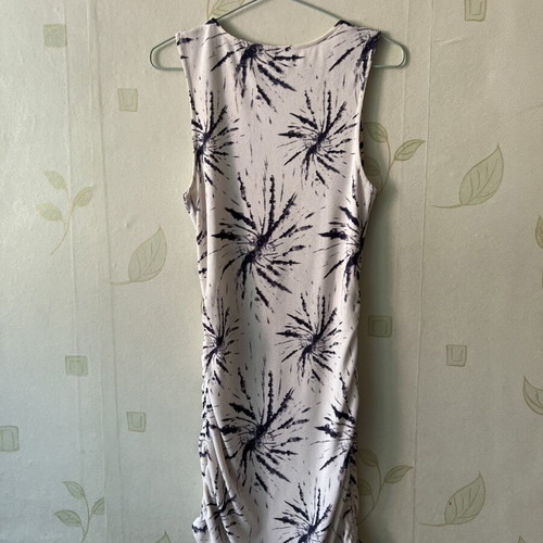 White elastic dress with unique design and side ties, like new, sizes S/M