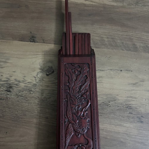 Japanese wooden box with 16 used chopsticks and palm carving
