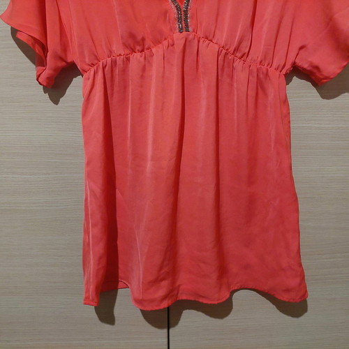 Coral satin-like blouse with V and rhinestones like new, size Medium