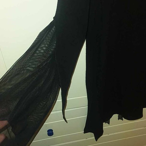 Dina black blouse like new with ruffle and tulle sleeves
