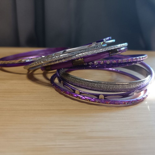 Set of purple and silver bracelets