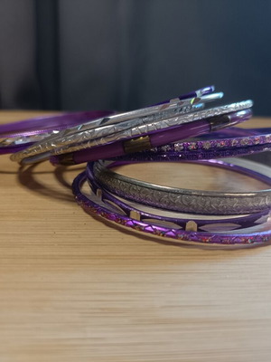 Set of purple and silver bracelets