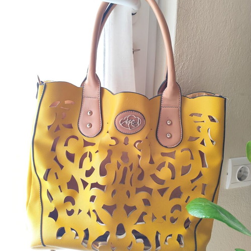 Yellow handbag used with beige details