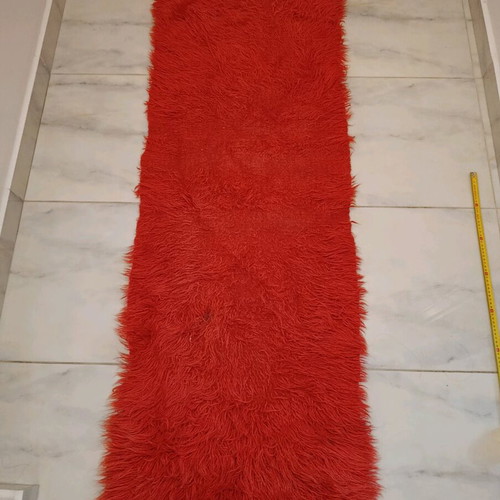 Traditional flokati runner used, red wool