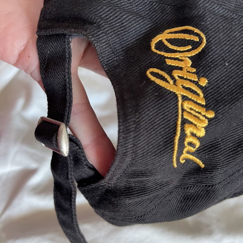 Magners cider branded hat used with small discoloration