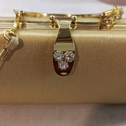 Gold evening handbag like new with missing rhinestone
