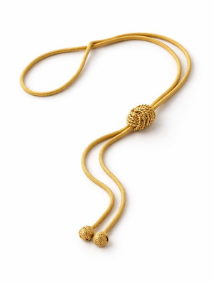 Vintage gold cord necklace used with decorative knot