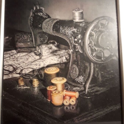 Engraving of old sewing machine with new frame