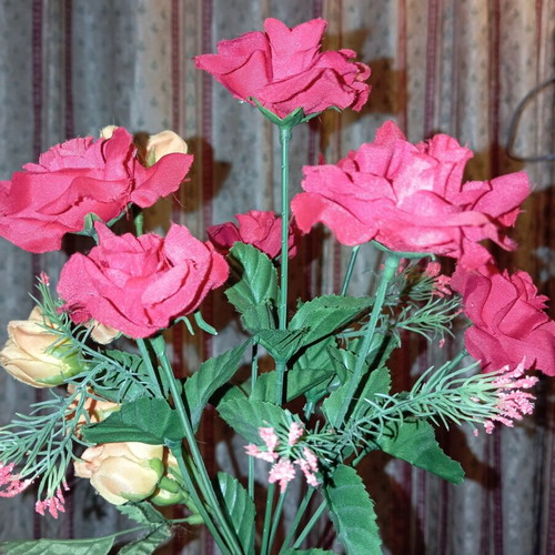Bouquet of red artificial roses like new for decoration
