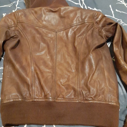 Brown leather women's jacket used with broken zipper