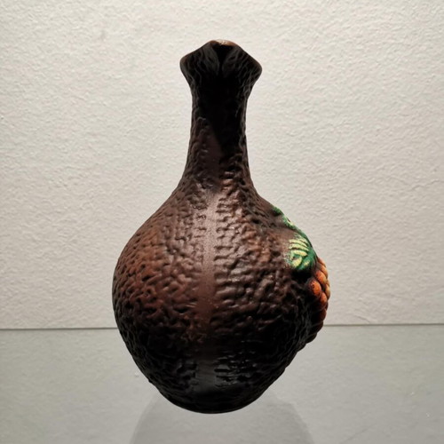 Clay jug used with embossed designs and grape cluster