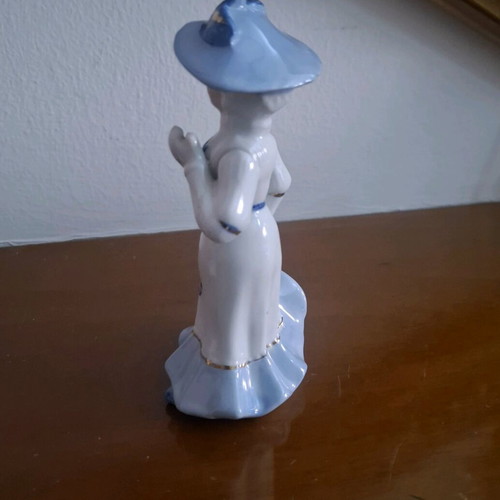 Retro porcelain woman figurine with gold details like new