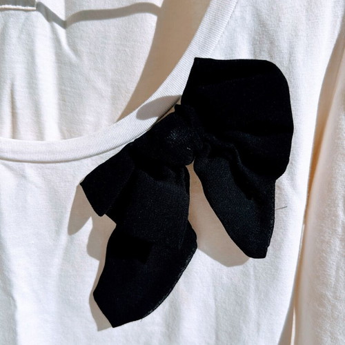 Blouse with black bow and padded sleeves used, size M