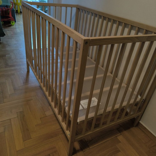 IKEA baby cot with mattress and bedding