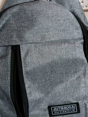 Back or chest bag new, gray with compartments and headphone opening
