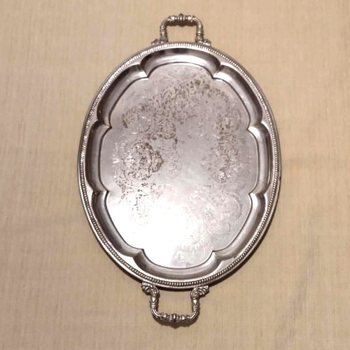 Silver-plated serving tray used with ornate handles