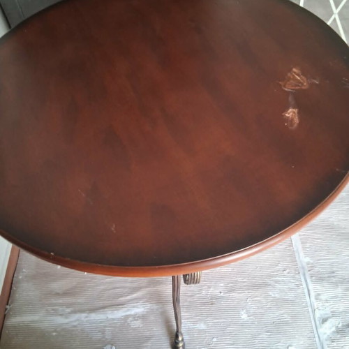 Rotunda table like new with heavy brass base and wooden top