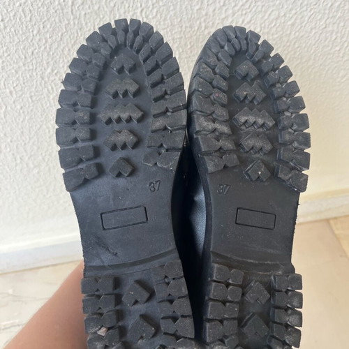 Tsouderos moccasins like new with gold detail and lug sole