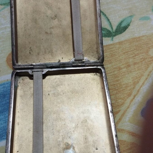 Collectible cigarette case used, carved