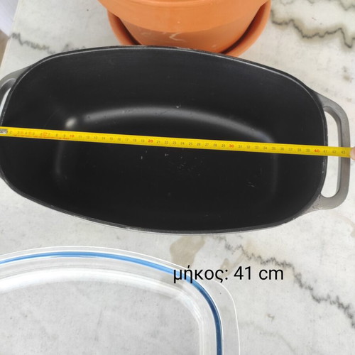 Glass Pyrex and cast iron pot used with surface wear