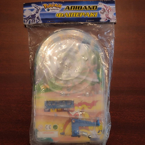 Pokemon set: vintage flipper, sleeves, embroidered badge
