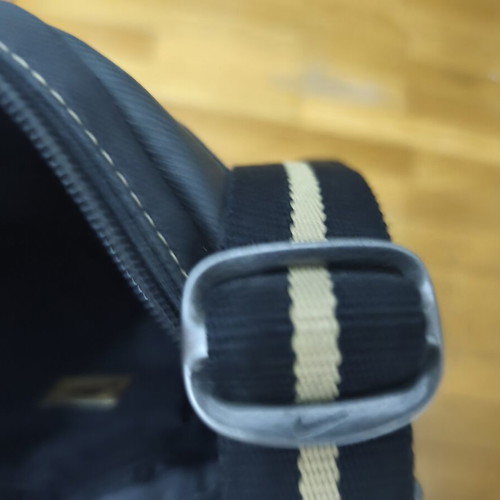 Nike shoulder bag used, black and gold with logo imperfections