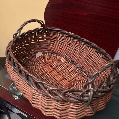 Wicker storage basket used, rustic and practical