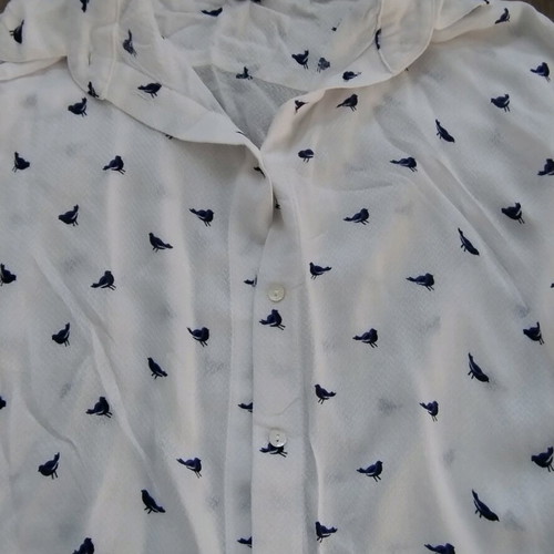 Sleeveless shirt with small birds H&M like new