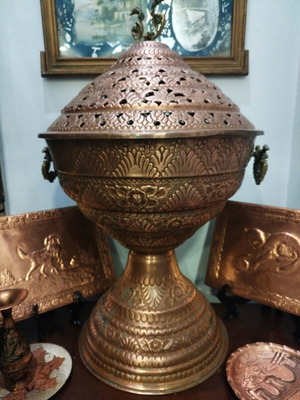 Carved ornate magkali lamp used, folk art
