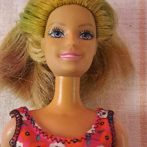 Barbie doll used with modern dress and painted cut hair