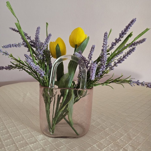 Glass vase with decorative flower arrangement