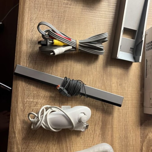 Nintendo Wii console with cables and one controller