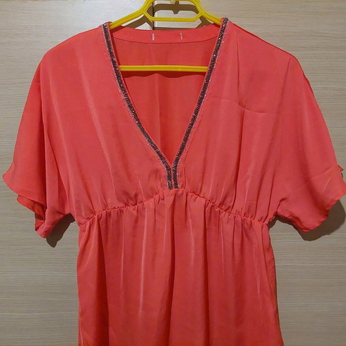 Coral satin-like blouse with V and rhinestones like new, size Medium
