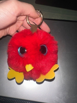 Fluffy keychain like new, red and yellow