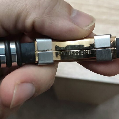Stainless Steel Bracelet like new with gold chain and black rubber band