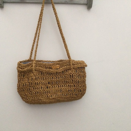 Knitted bag like new with golden yarn and fabric lining